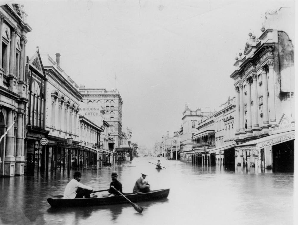 1893 Brisbane flood: boats on flooded Queen Street between multi-storey commercial buildings
