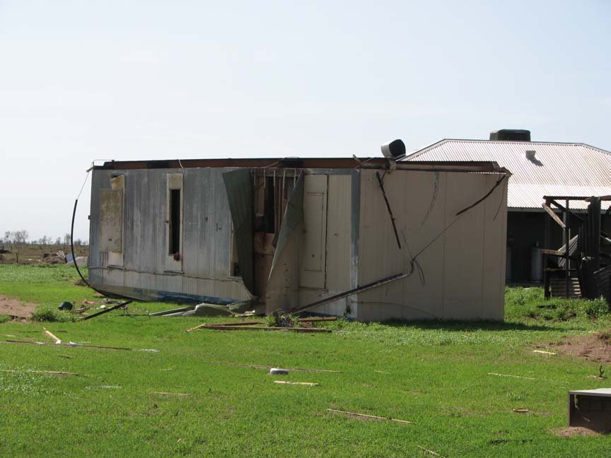 Photo of a small hut at De Grey Station flipped on its side after Cyclone George
